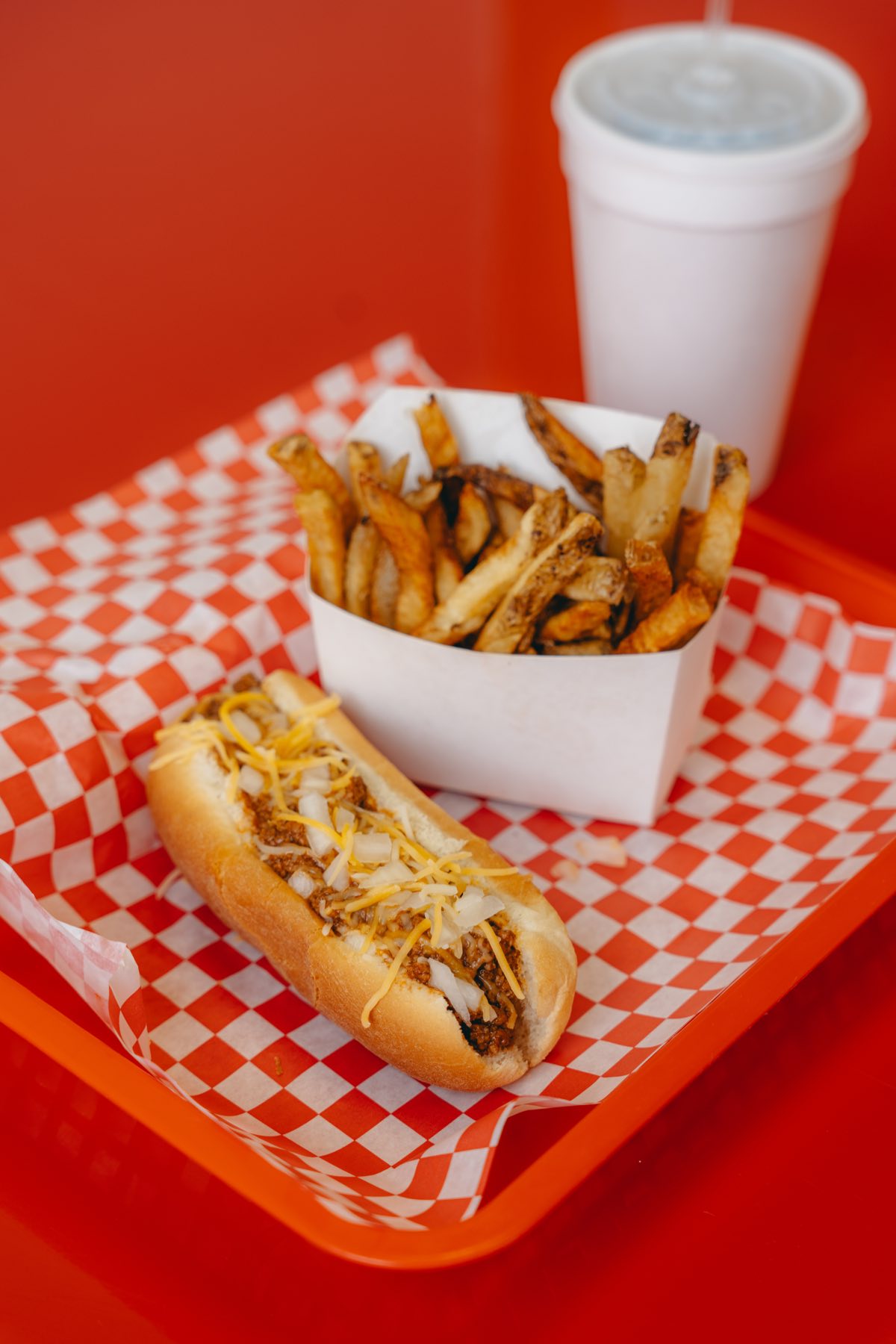 A loaded all-beef Dog Et Al hot dog with fries